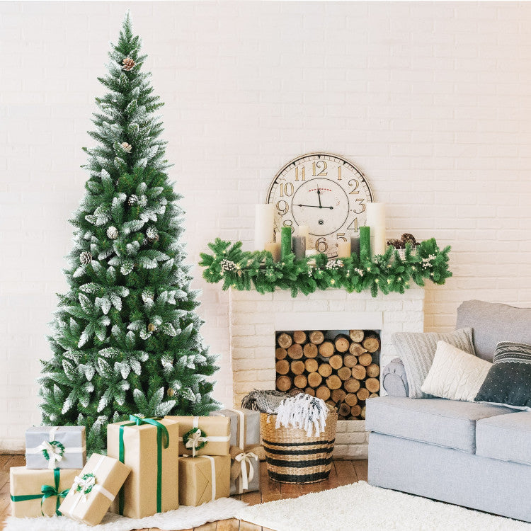 Living room decorated for Christmas with a tree, presents, and fireplace.