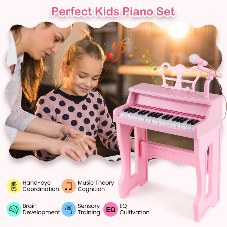 Child happily playing 37 key piano keyboard with sing-along microphone