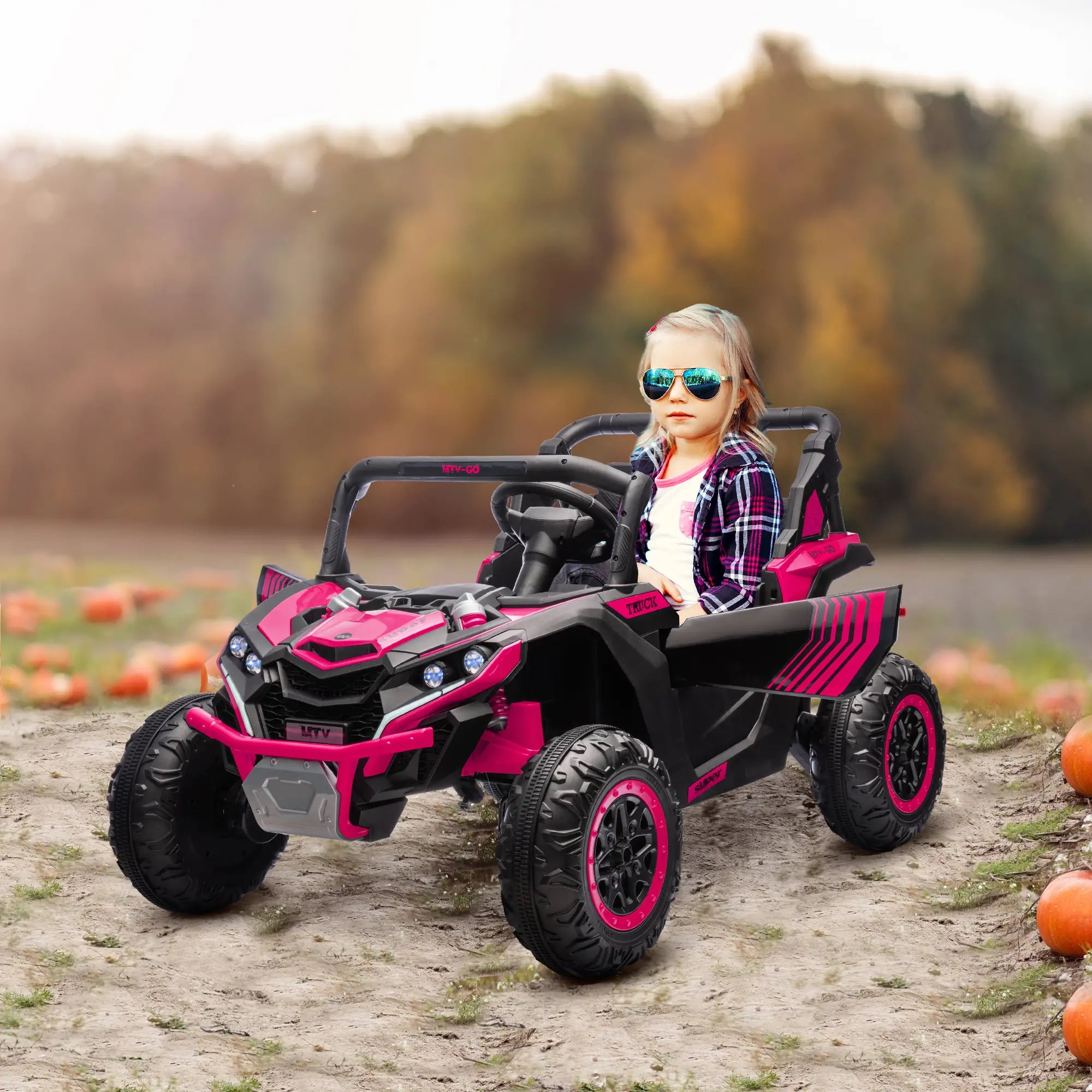 Dual motor kids electric UTV driving on outdoor terrain