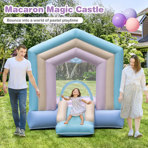 Pastel macaron inflatable bounce house with slide in backyard