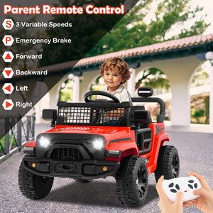 Child playing with a red toy truck outdoors, holding a remote control.
