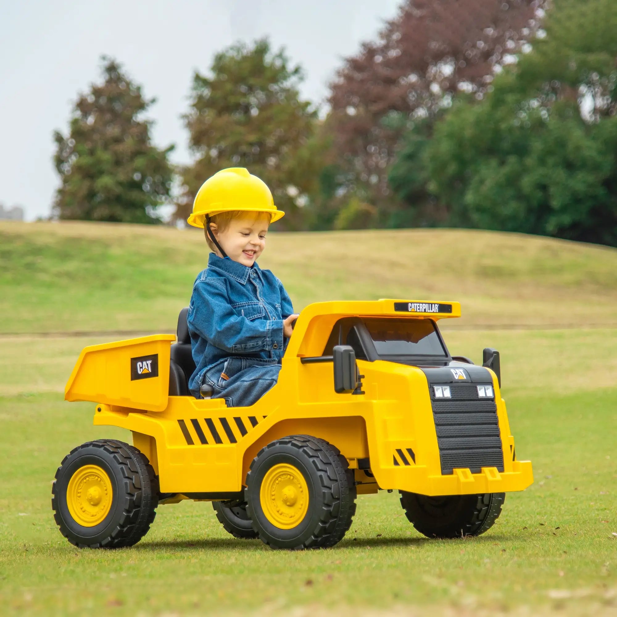 Front view of 12V electric ride-on excavator for kids with working bucket