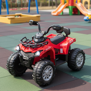 Red toy ATV on a playground with colorful equipment in the background