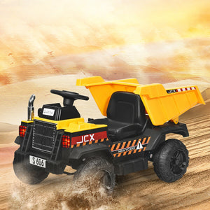 Toy dump truck with yellow bed and black body on a sandy background