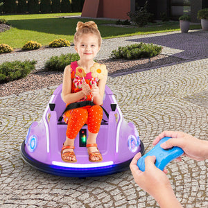 Child playing with a purple toy car on a stone patio