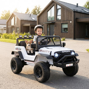 Child driving a toy off-road vehicle with a dog in the back, in front of a modern house.