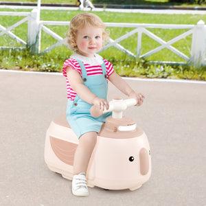 Child sitting on a pink toy horse with a grassy area in the background