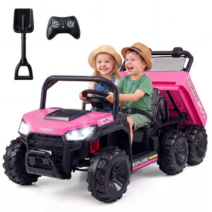 Pink and black toy dump truck with two children inside, a shovel, and remote control on a white background.