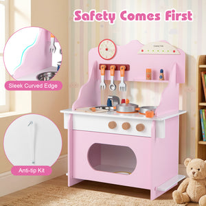 Pink children's play kitchen with safety features in a room setting.
