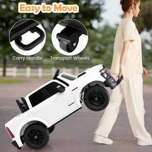 White toy truck with carry handle and transport wheels, being pushed by a person outdoors.