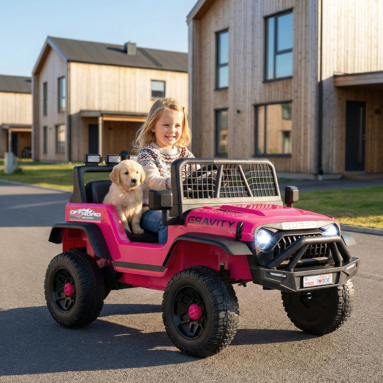 Child and dog in a pink toy jeep on a residential street