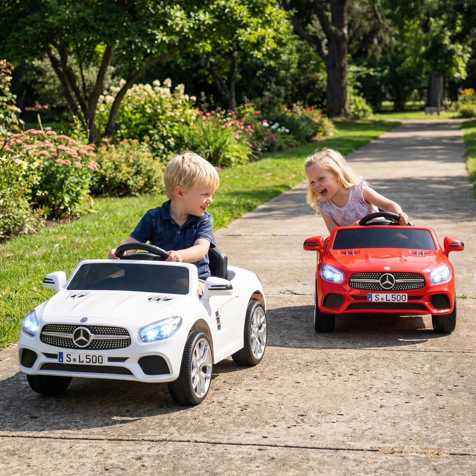 Two children playing with toy Mercedes-Benz cars on a path in a park.
