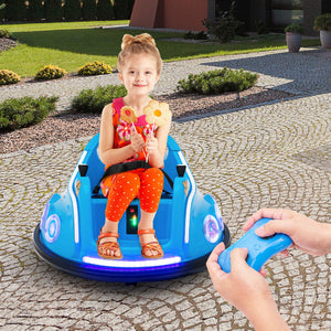 Child sitting in a blue toy car with glowing wheels, outdoors on a stone path.