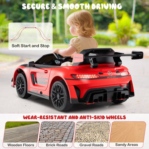 Child in a red toy car with safety features highlighted on a blurred outdoor background