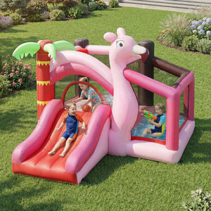 Children playing on a pink inflatable slide and play area in a garden.