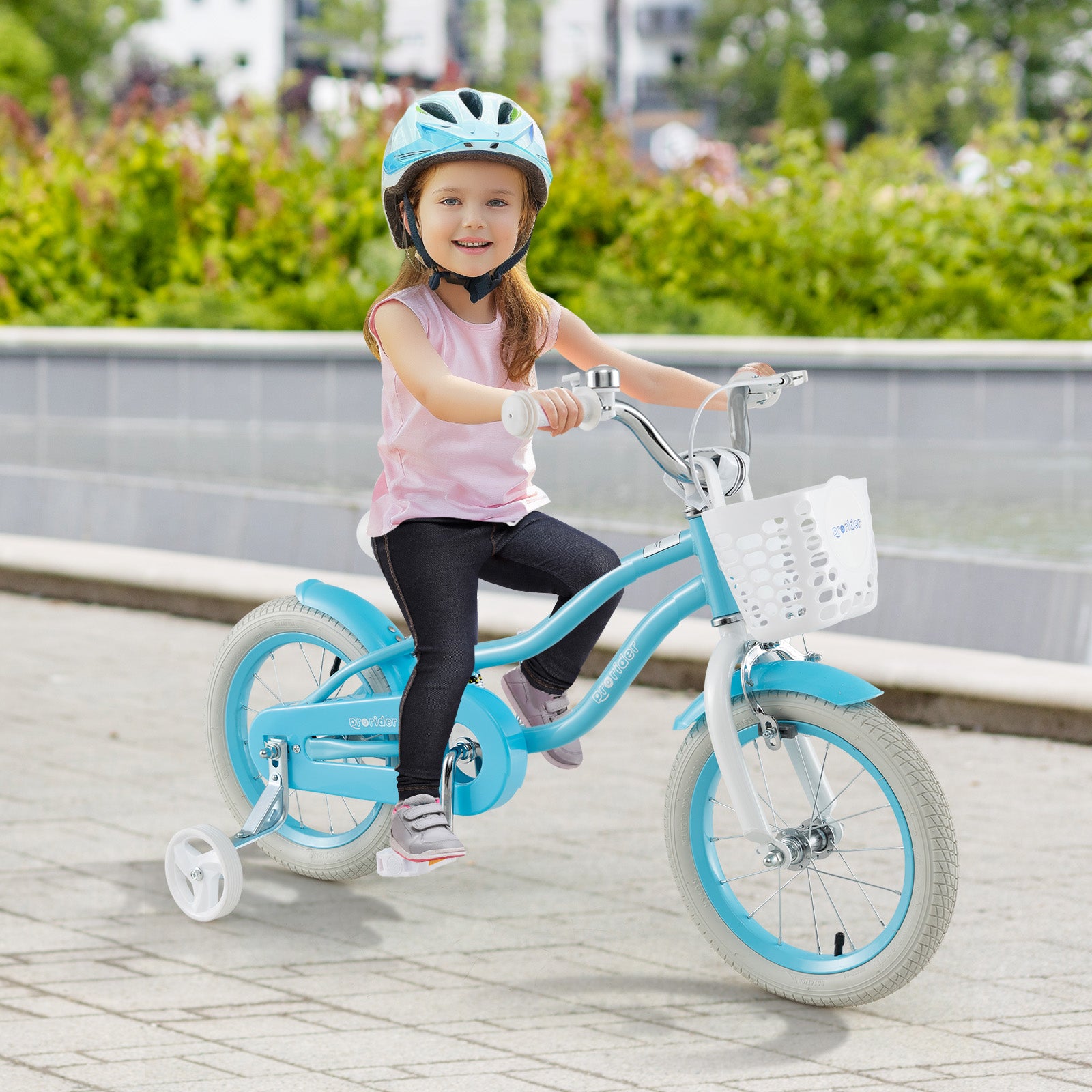 Child riding a blue bicycle with training wheels on a paved path.
