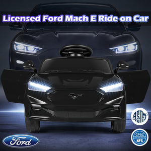 Black toy car resembling a Ford Mach E with illuminated headlights on a dark background.