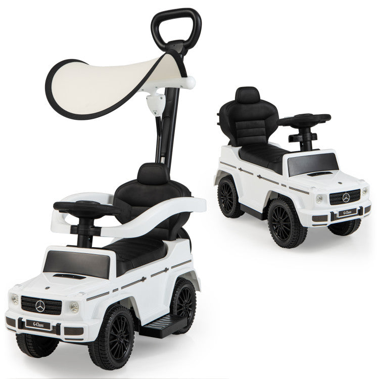 Two white toy cars with Mercedes-Benz logo on a white background