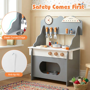 Children's play kitchen set with safety features in a room setting.