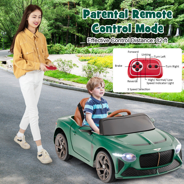 Woman pushing a green toy car with a child inside, set against a natural background.