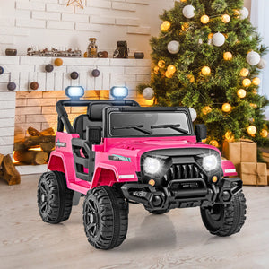 Pink toy SUV with black accents in a room decorated for Christmas.
