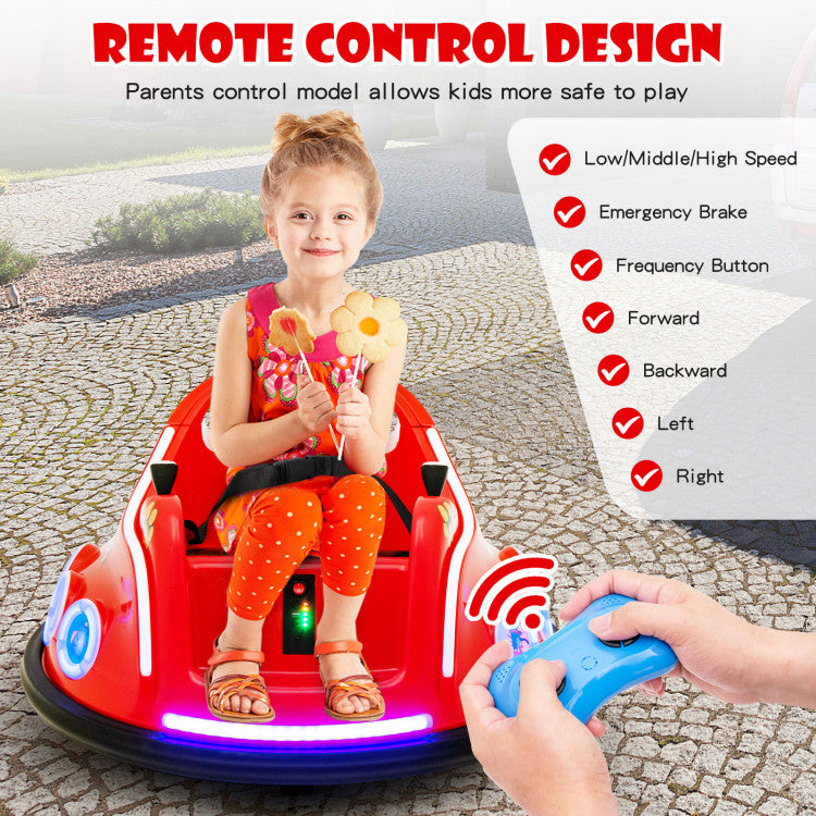 Child sitting in a red toy car with a remote control, outdoors.