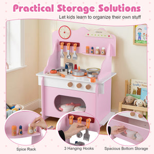 Pink toy kitchen set with various accessories and storage solutions for children.