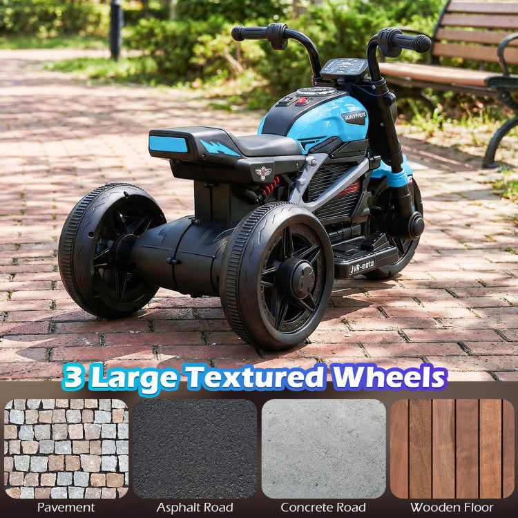 Children's trike with large textured wheels on a brick path, surrounded by greenery.