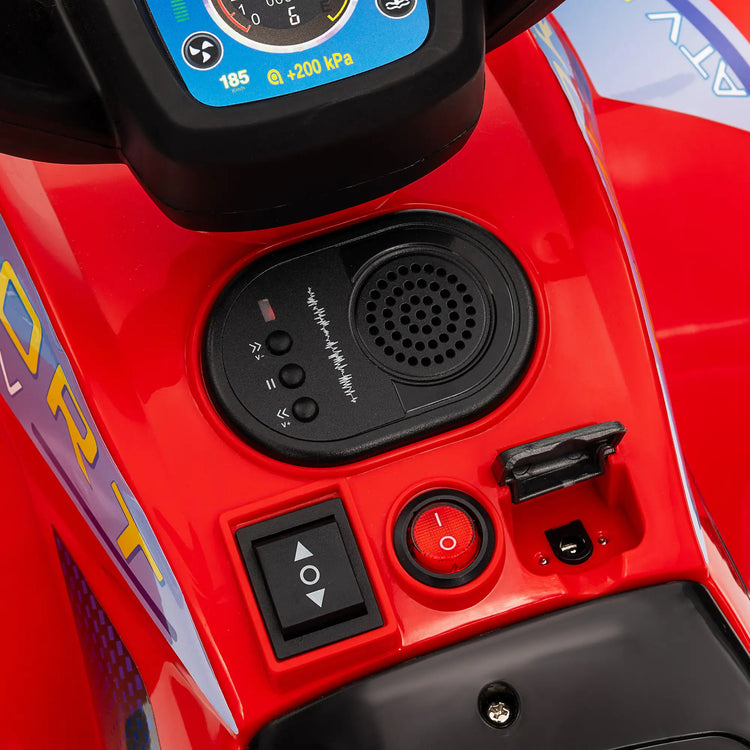 Close-up of a red vehicle's control panel with buttons and a display.
