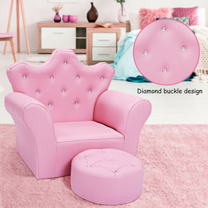 Pink children's chair with diamond buckle design and matching ottoman in a room setting.