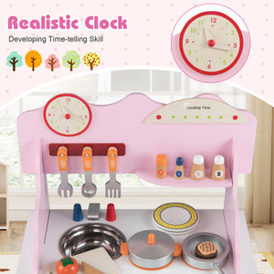 Children's play kitchen set with toy clock, utensils, and cookware on a pink stand.