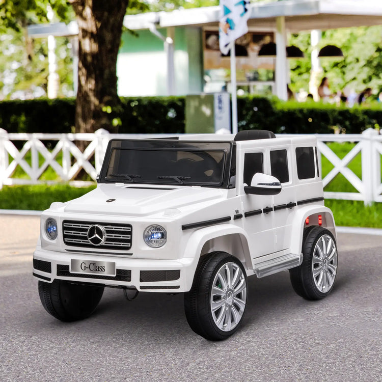 Mercedes Benz G500 black ride-on car compared to pink Jeep Powerwheels