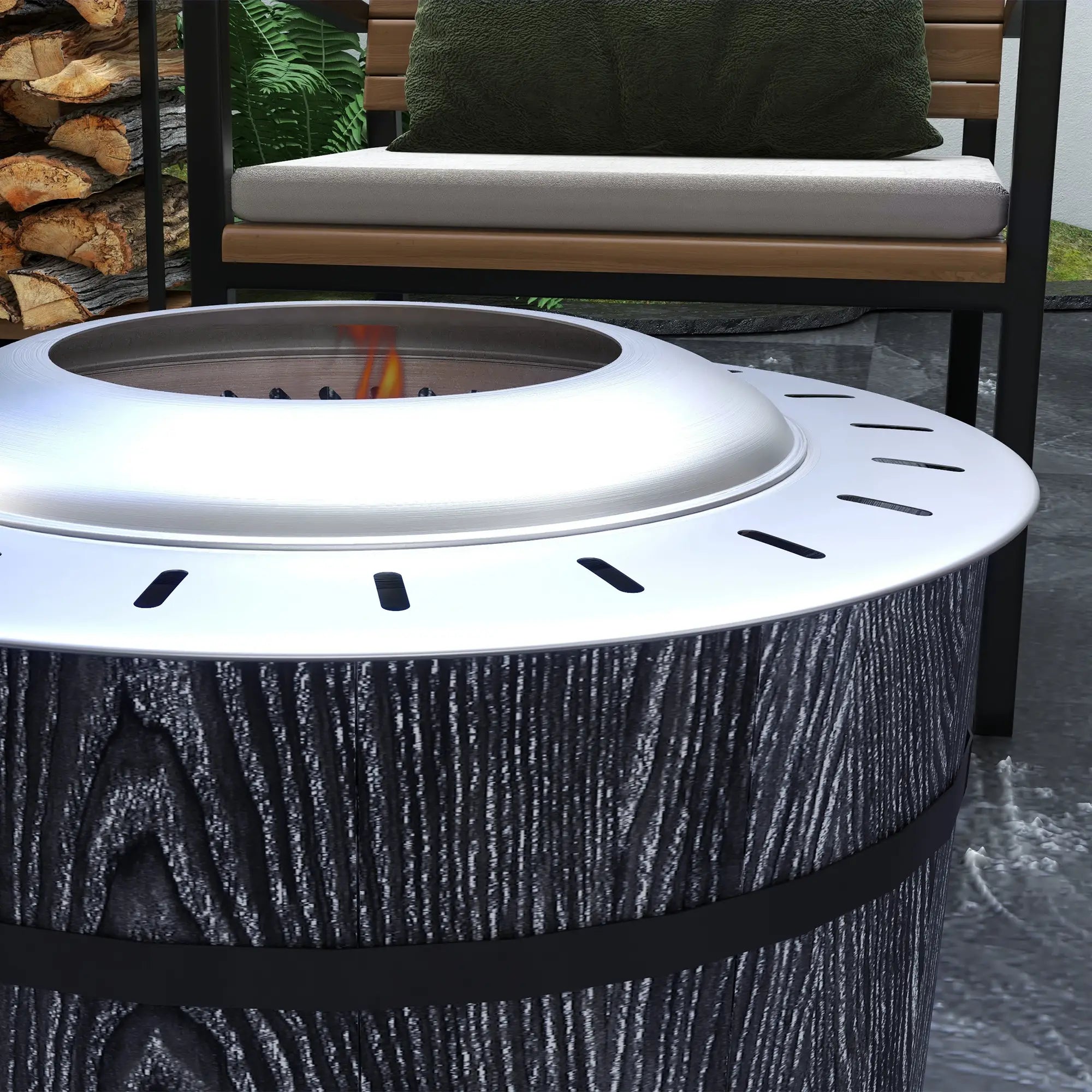 Outdoor fire pit with wooden logs and a bench in the background