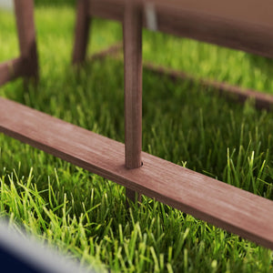 Wooden swing seat on grass