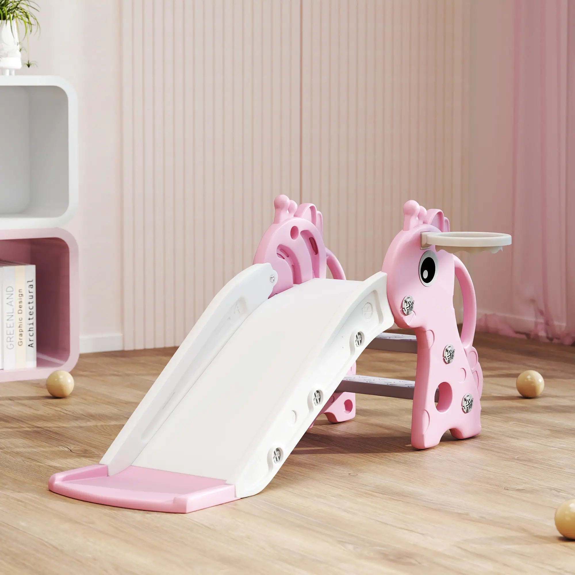 Pink and white children's slide with horse design on a wooden floor.