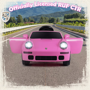 Pink toy car on a road with a scenic background