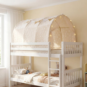 White children's bed with a canopy and fairy lights in a room with a window and bookshelf.