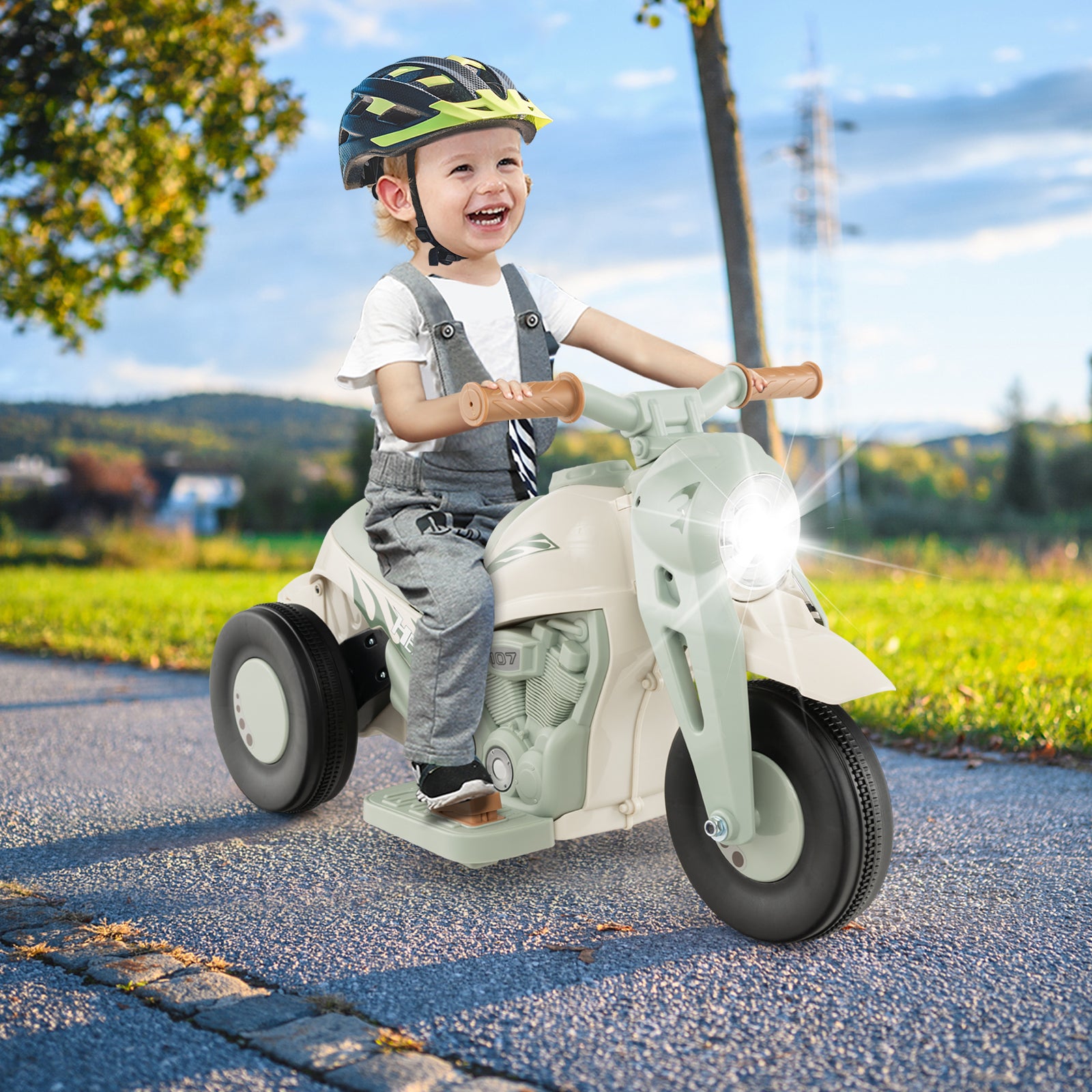 Child riding a toy motorcycle outdoors on a sunny day