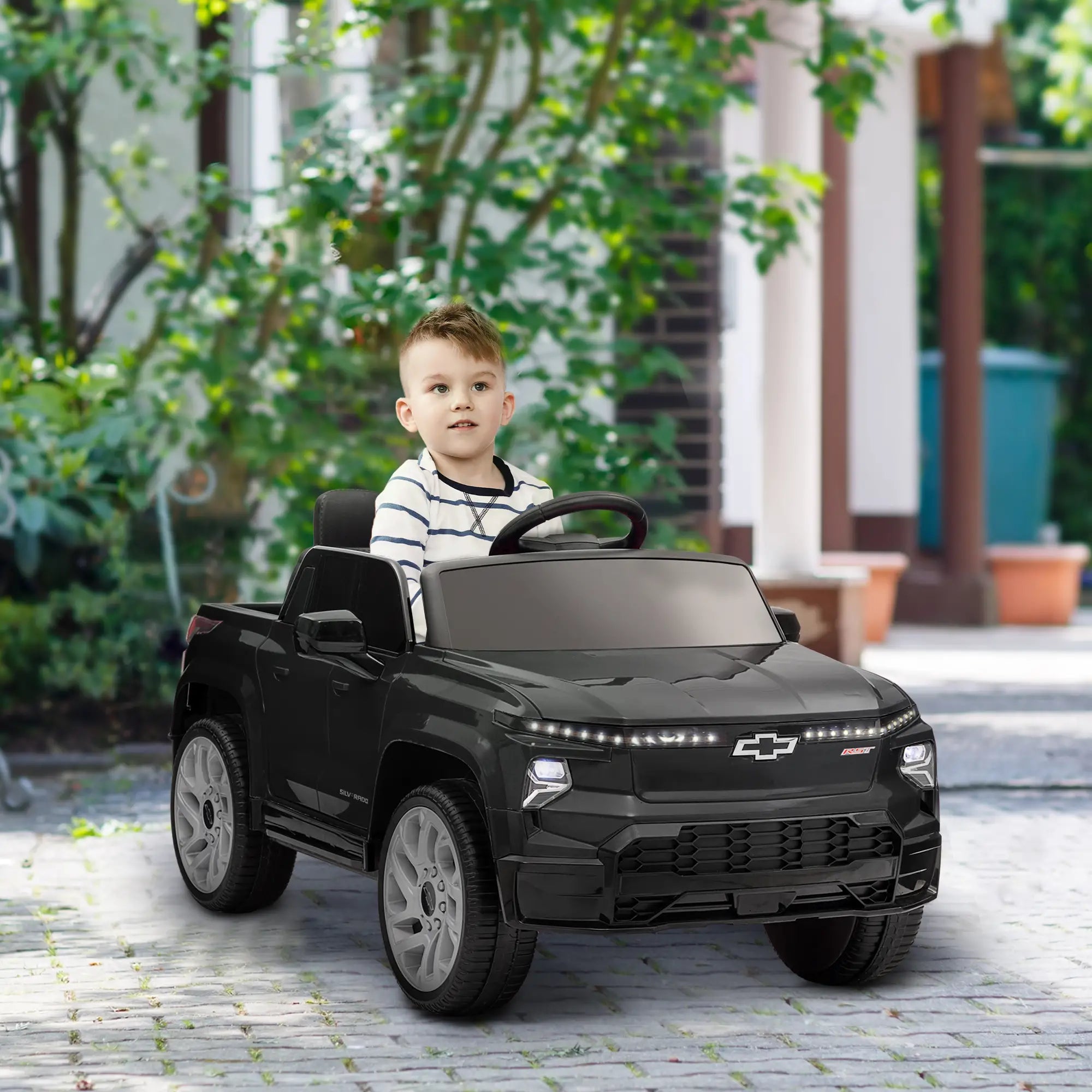 Kids’ ride-on car with visible 12V charging cable setup
