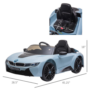 Child driving a BMW I8 battery powered electric toy car.