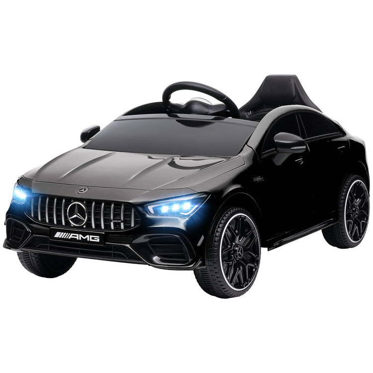 Child sitting inside Mercedes AMG 12V ride-on vehicle.