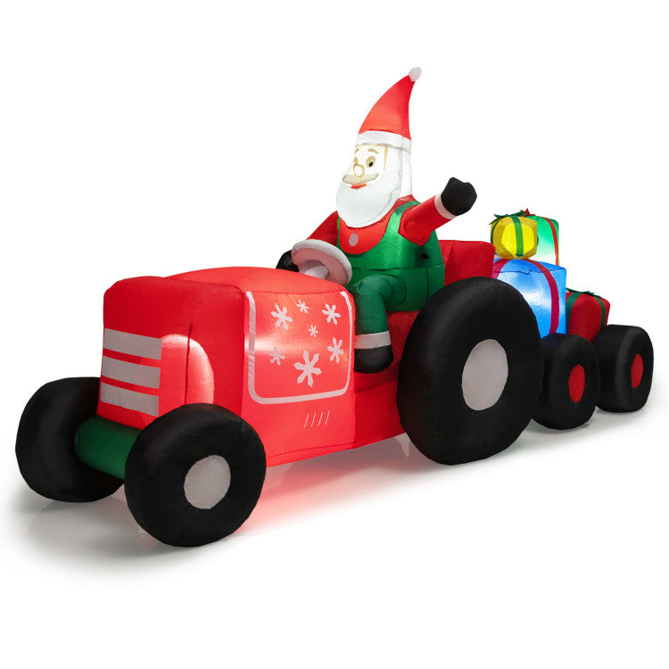 Inflatable Santa driving a red car with gifts on a white background