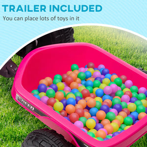 Pink toy wagon filled with colorful balls on grass, with text indicating a trailer included.