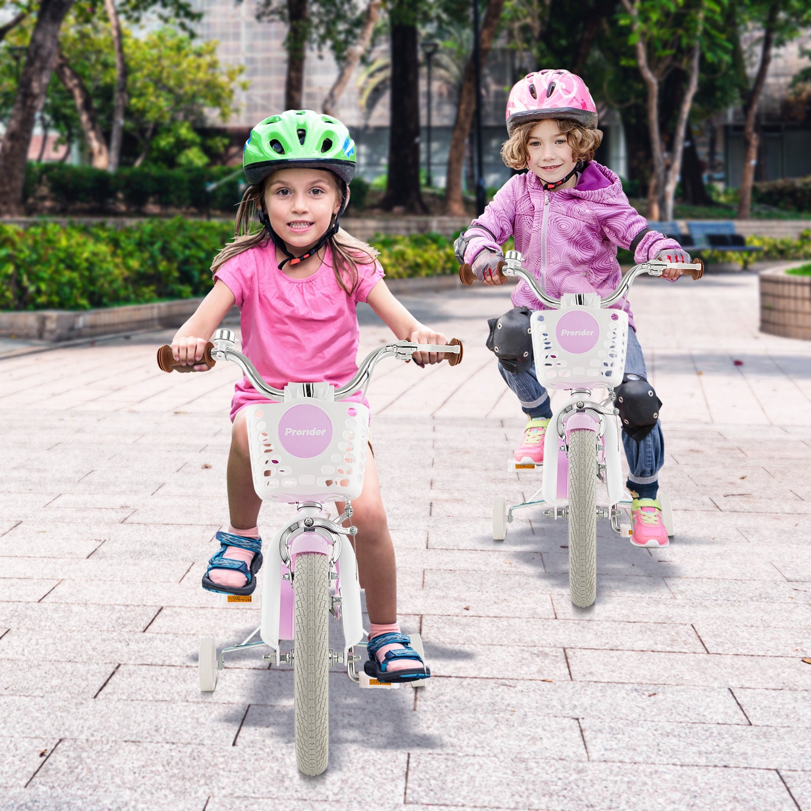 Two children riding pink bicycles with helmets on a paved path.