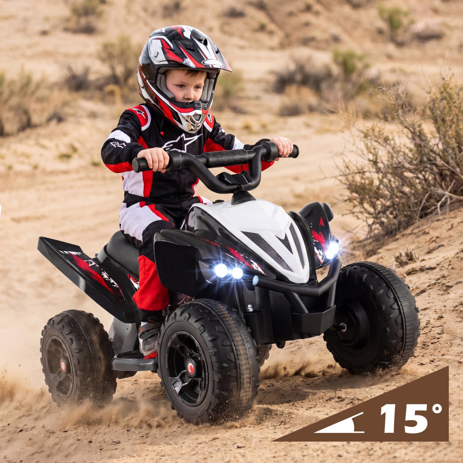 Child riding a toy ATV in a desert setting with a helmet on