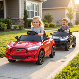 Two children playing with toy cars on a driveway in front of a house.