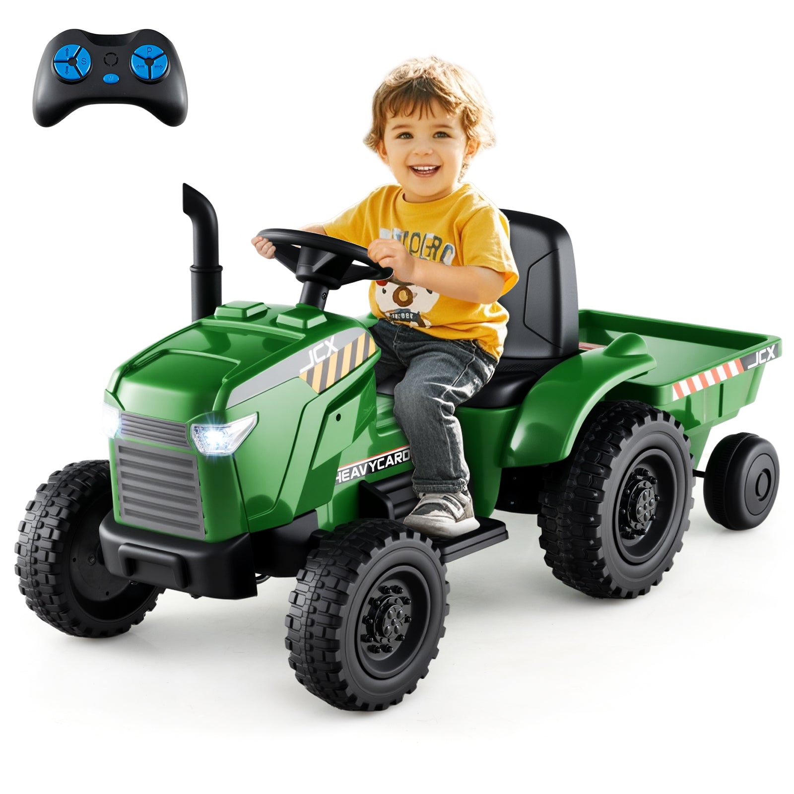 Child sitting in a green toy tractor with a remote control on a white background