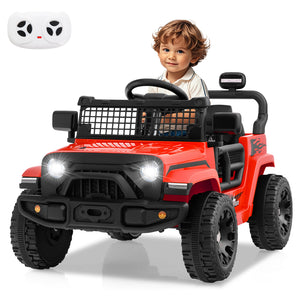 Child sitting in a red toy jeep with a remote control on a white background