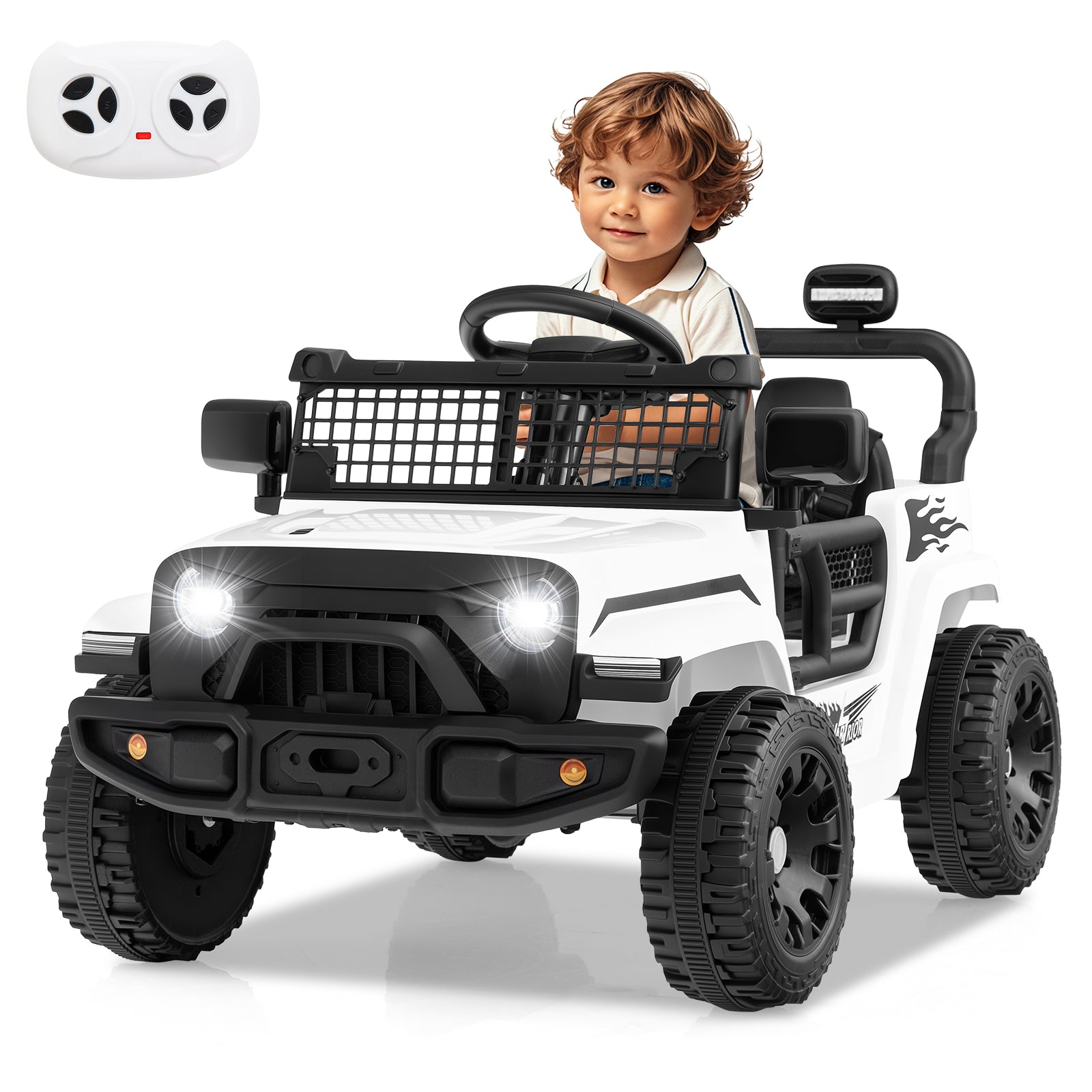 Child sitting in a toy off-road vehicle with a remote control on a white background