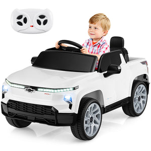 Child playing with a white toy car with remote control on a white background